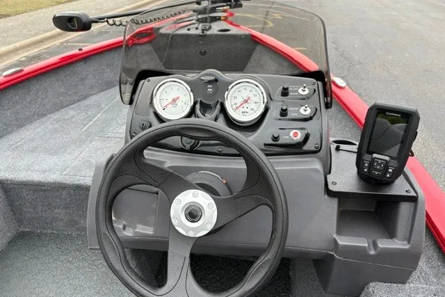 Slide: The Image of Steering console of 2027 Tracker Super Guide V-16 SC boat with gauges and Garmin device. - 15