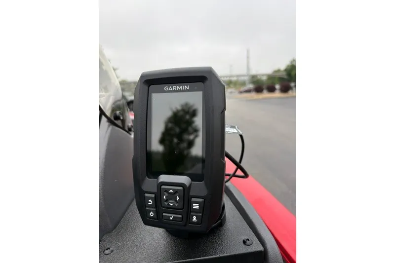 Slide: The Image of Garmin device on 2027 Tracker Super Guide V-16 SC boat dashboard. - 16
