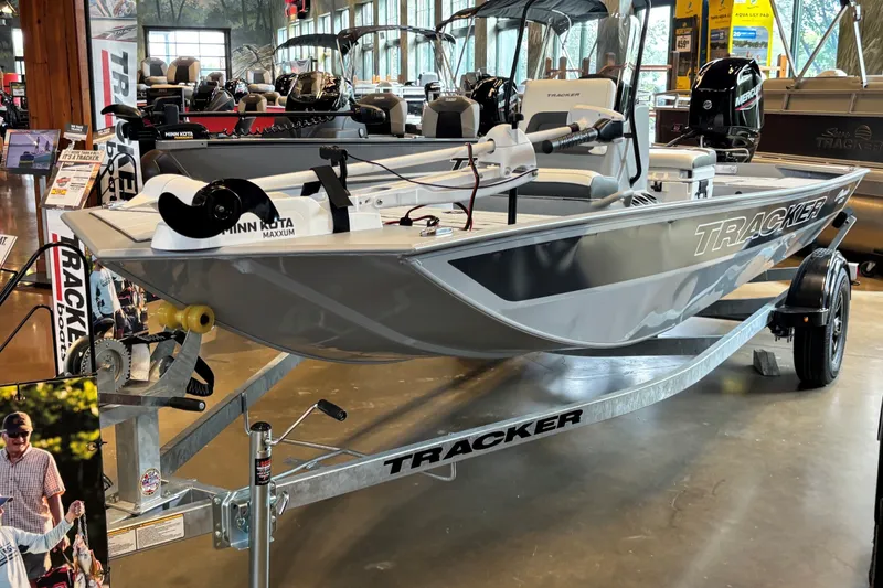 The Image of 2027 Tracker Bass Tracker Classic CC boat displayed in showroom on trailer. - 0