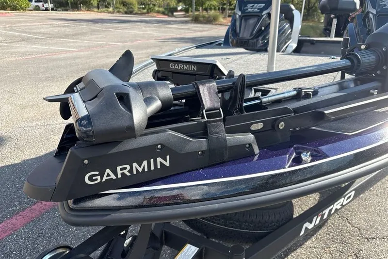 Slide: The Image of 2027 Nitro Z18 XL Pro boat with Garmin equipment in a parking lot. - 5