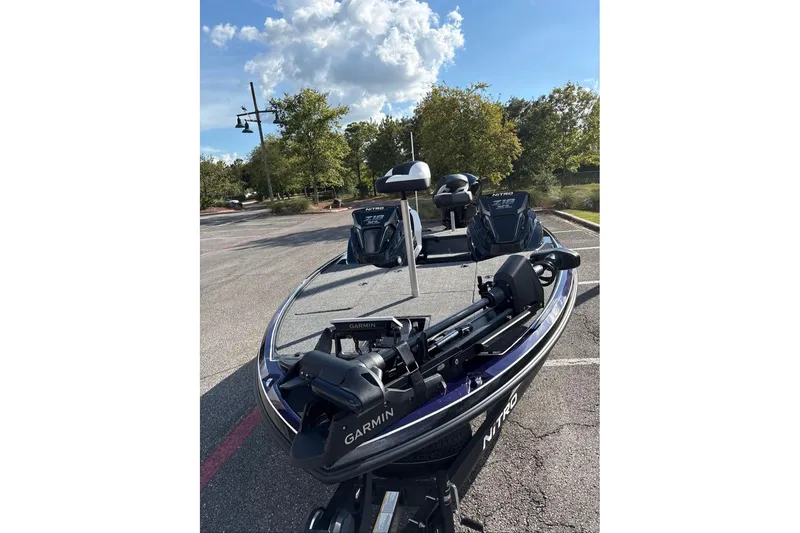 Slide: The Image of 2027 Nitro Z18 XL Pro boat with Garmin equipment in a parking lot. - 6