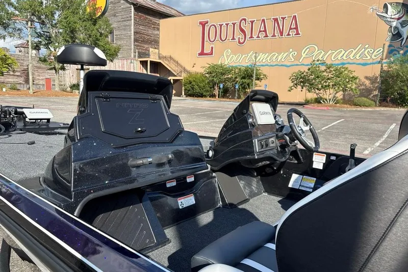 Slide: The Image of Nitro Z18 XL Pro 2027 boat interior with Garmin system, Louisiana Sportsman's Paradise backdrop. - 11