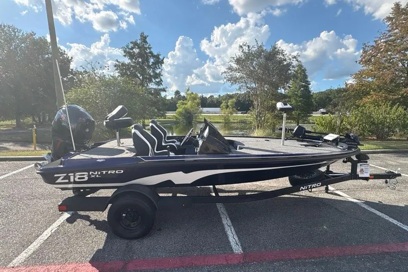 The Image of 2027 Nitro Z18 XL Pro boat on trailer in scenic outdoor setting. - 0