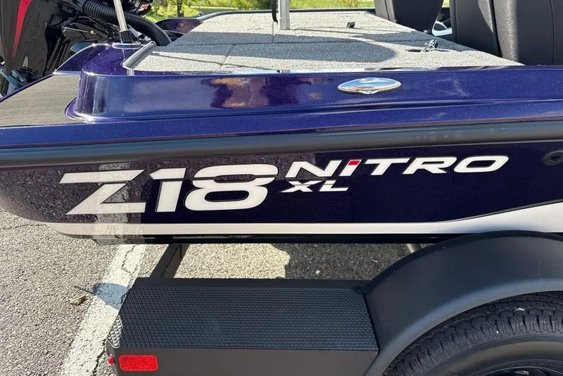 Slide: The Image of 2027 Nitro Z18 XL Pro boat side view with logo and trailer. - 1