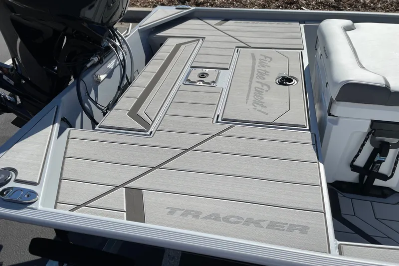 Slide: The Image of 2027 Tracker Bass Tracker Classic CC boat deck with sleek design and storage compartments. - 14