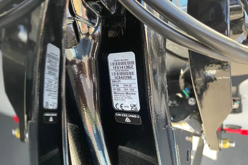 Slide: The Image of Close-up of a 2027 Tracker Bass Tracker Classic CC engine label with specifications. - 54