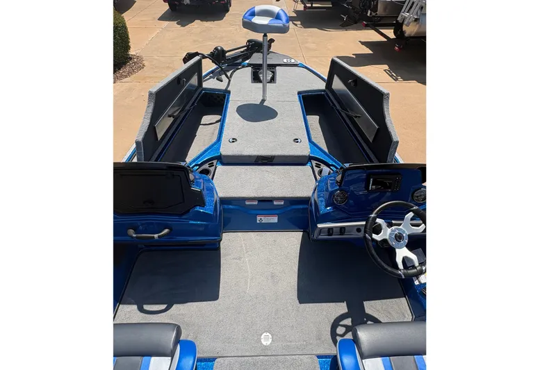 Slide: The Image of 2027 Nitro Z18 XL boat interior with steering wheel and storage compartments. - 8