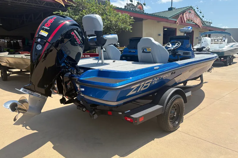 Slide: The Image of 2027 Nitro Z18 XL boat with powerful outboard motor, displayed outdoors. - 5