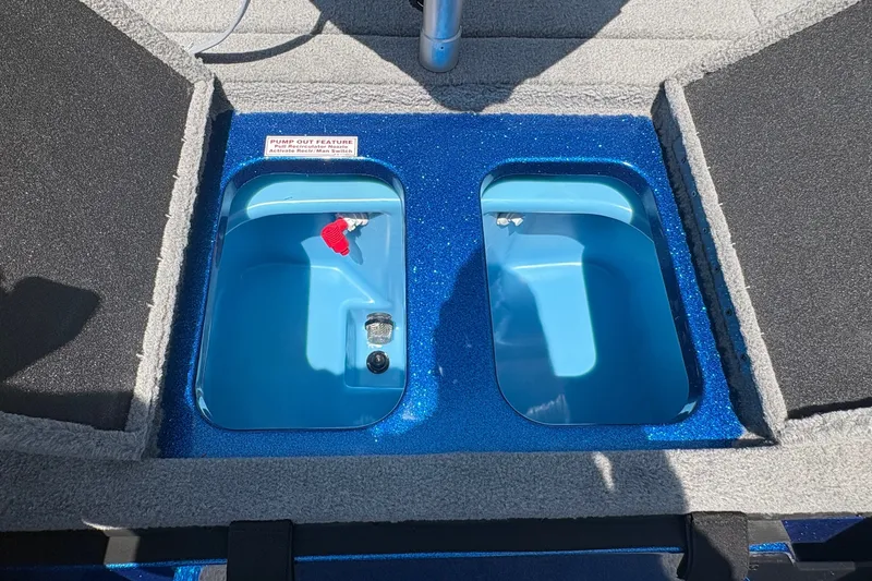 Slide: The Image of Livewell compartments on a 2027 Nitro Z18 XL boat, featuring blue interiors and pump-out feature. - 13