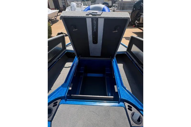 Slide: The Image of Open storage compartment of 2027 Nitro Z18 XL boat, showcasing interior space. - 9