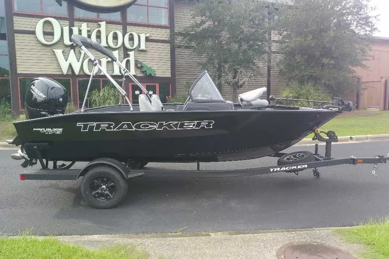 The Image of 2027 Tracker Pro Guide V-175 Combo boat on trailer outside Outdoor World. - 0