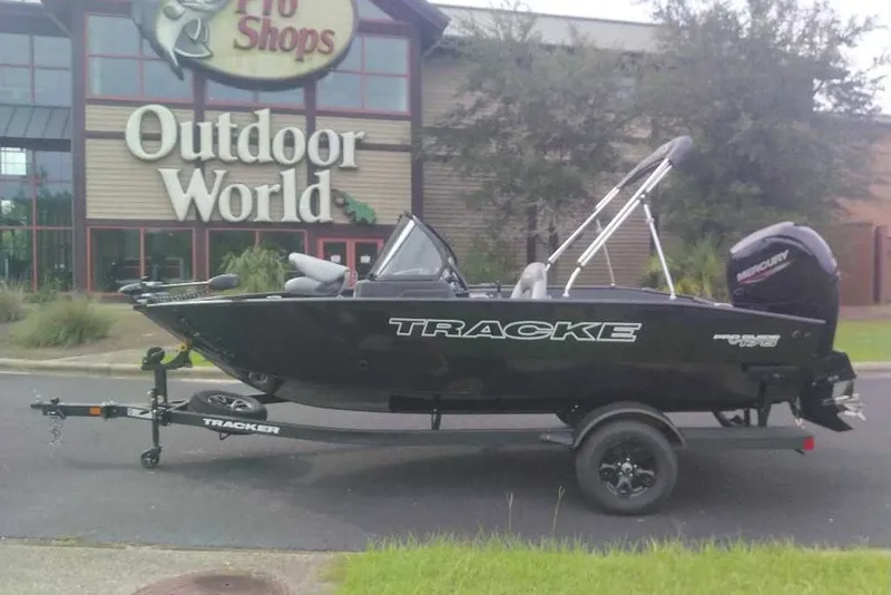 Slide: The Image of 2027 Tracker Pro Guide V-175 Combo boat outside Outdoor World store. - 13