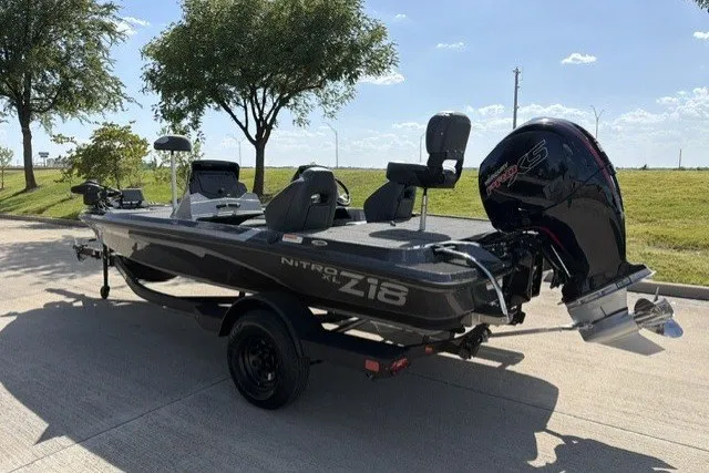 Slide: The Image of 2027 Nitro Z18 XL Pro boat on trailer, parked outdoors under clear sky. - 7