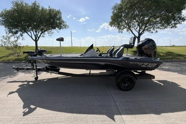 Slide: The Image of 2027 Nitro Z18 XL Pro fishing boat on trailer, parked outdoors. - 3