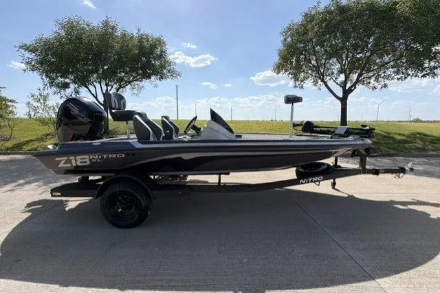 Slide: The Image of 2027 Nitro Z18 XL Pro boat on trailer, parked outdoors under clear sky. - 1
