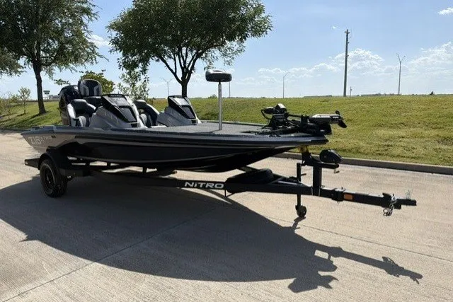 The Image of 2027 Nitro Z18 XL Pro boat on trailer, parked outdoors under clear sky. - 0