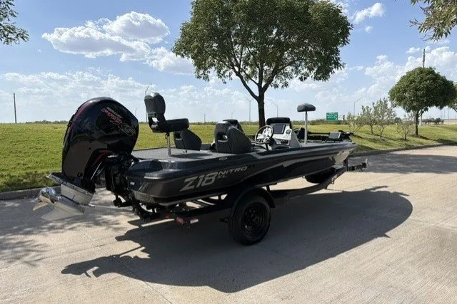 Slide: The Image of 2027 Nitro Z18 XL Pro boat parked on a sunny day, showcasing sleek design and powerful engine. - 6