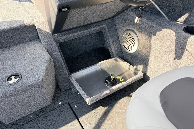 Slide: The Image of Interior of 2027 Tracker Pro Guide V-175 Combo boat, featuring storage compartment and speaker. - 32