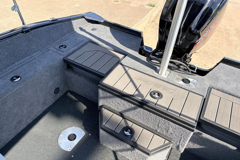 Slide: The Image of 2027 Tracker Pro Guide V-175 Combo boat interior with storage compartments and Mercury engine. - 43