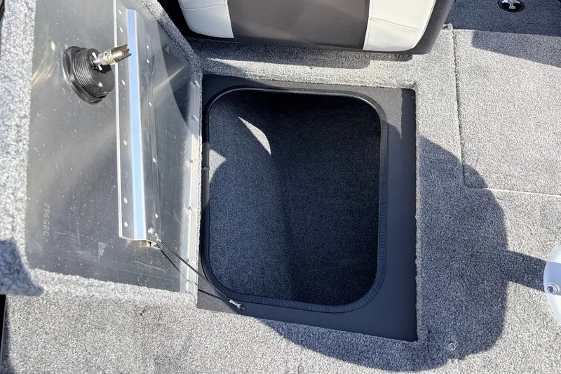 Slide: The Image of Open storage compartment in 2027 Tracker Pro Guide V-175 Combo boat interior. - 18