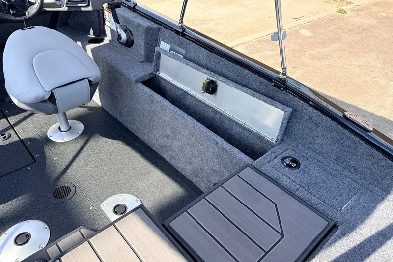 Slide: The Image of 2027 Tracker Pro Guide V-175 Combo boat interior with seating and storage compartments. - 48