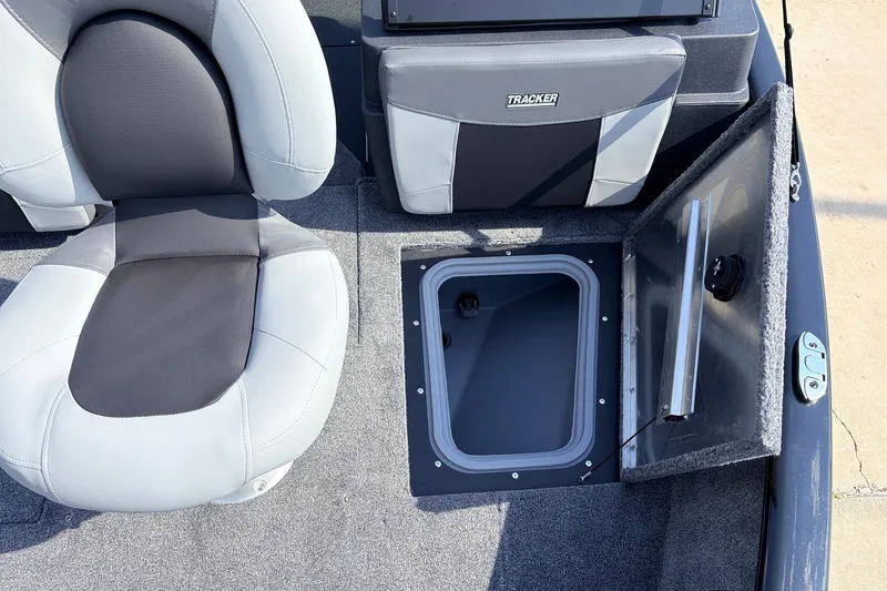 Slide: The Image of 2027 Tracker Pro Guide V-175 Combo boat interior with storage compartment and seating. - 15