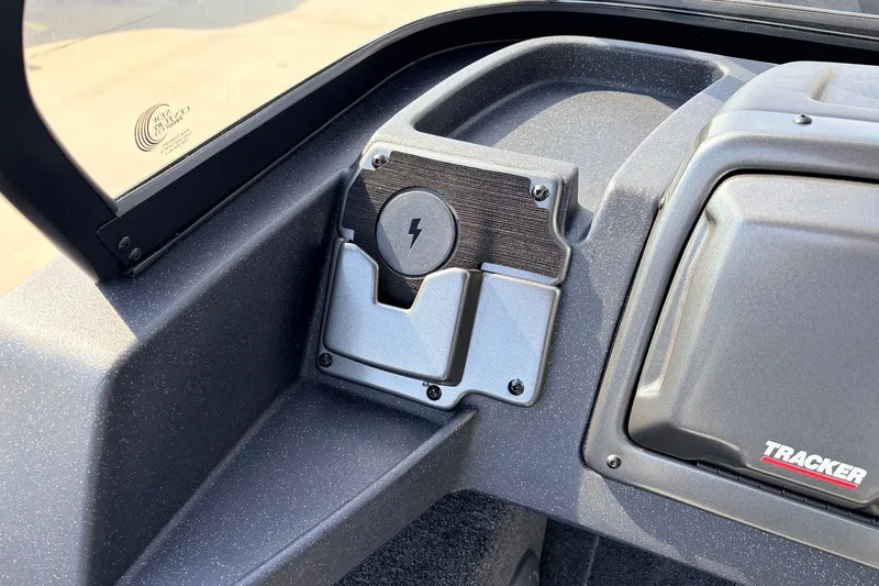 Slide: The Image of 2027 Tracker Pro Guide V-175 Combo dashboard with charging port and Tracker logo. - 25