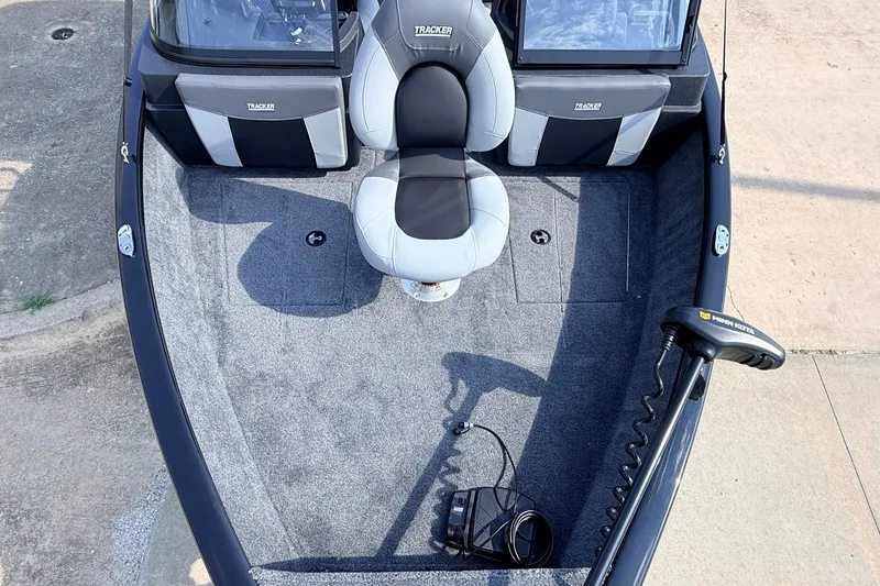 Slide: The Image of 2027 Tracker Pro Guide V-175 Combo boat interior with seating and Minn Kota trolling motor. - 14
