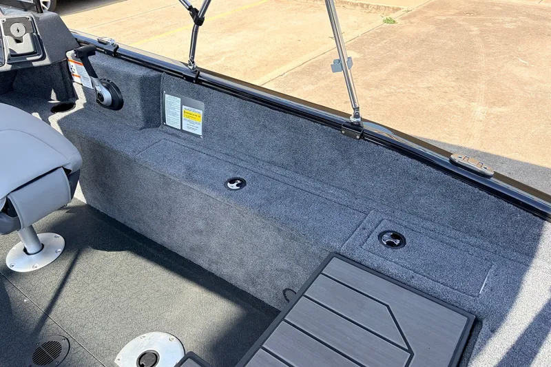 Slide: The Image of Interior of 2027 Tracker Pro Guide V-175 Combo boat, featuring seating and storage compartments. - 47