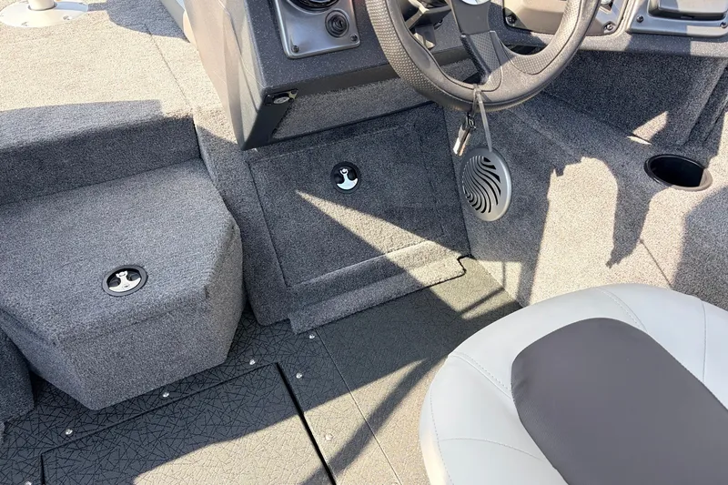 Slide: The Image of Interior of 2027 Tracker Pro Guide V-175 Combo boat, featuring steering wheel and seating. - 31