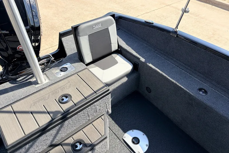 Slide: The Image of 2027 Tracker Pro Guide V-175 Combo boat interior with seating and storage compartments. - 35