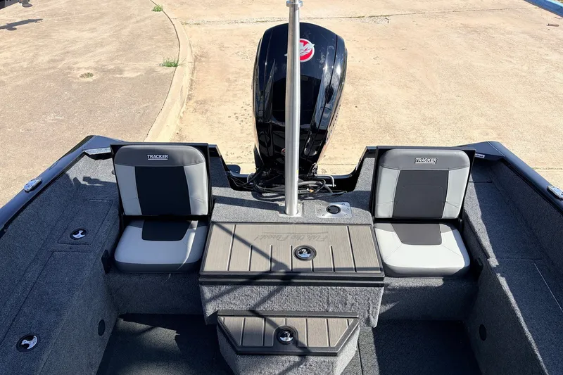 Slide: The Image of 2027 Tracker Pro Guide V-175 Combo boat interior with seating and motor. - 34