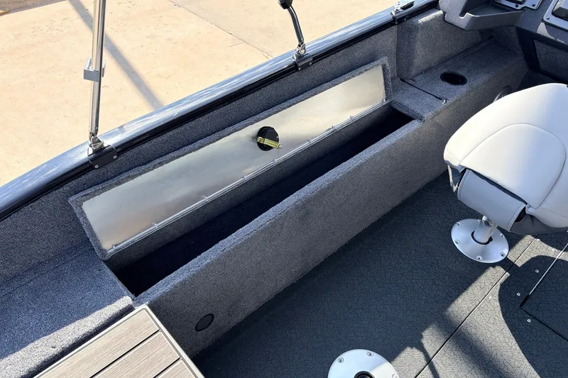 Slide: The Image of Interior of 2027 Tracker Pro Guide V-175 Combo boat, featuring seating and storage. - 45