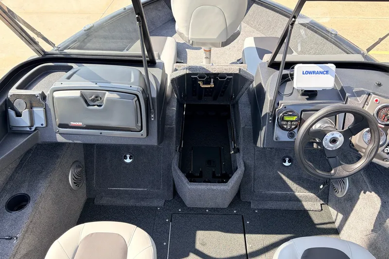 Slide: The Image of Interior view of 2027 Tracker Pro Guide V-175 Combo boat, featuring steering console and seating. - 19