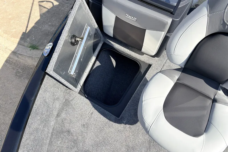 Slide: The Image of 2027 Tracker Pro Guide V-175 Combo boat interior with open storage compartment and seating. - 17