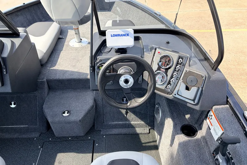 Slide: The Image of 2027 Tracker Pro Guide V-175 Combo boat dashboard with steering wheel and navigation system. - 28