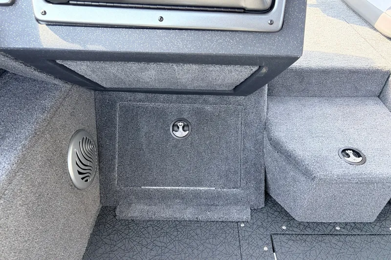 Slide: The Image of Interior of 2027 Tracker Pro Guide V-175 Combo boat with carpeted storage compartments. - 26