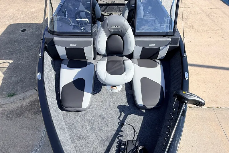 Slide: The Image of 2027 Tracker Pro Guide V-175 Combo boat interior with seating and controls. - 13