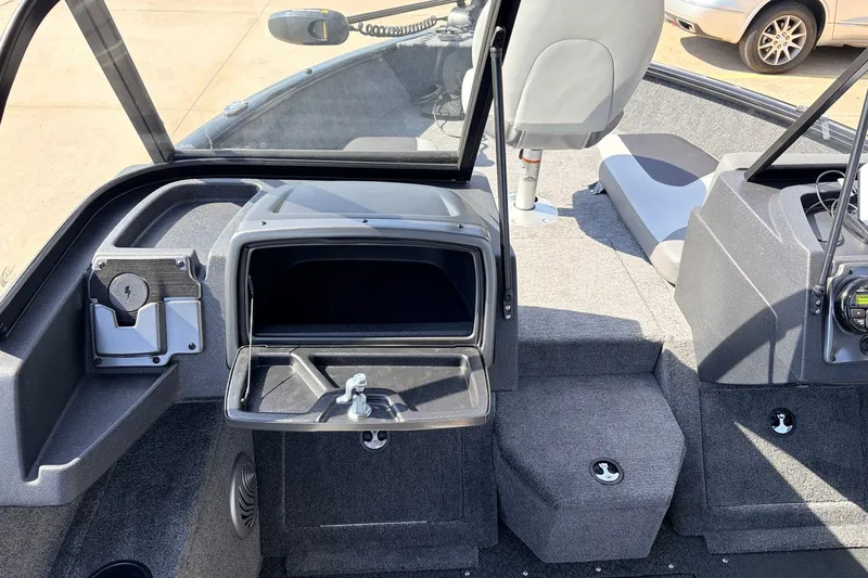 Slide: The Image of Interior view of 2027 Tracker Pro Guide V-175 Combo boat, featuring seating and storage compartments. - 24
