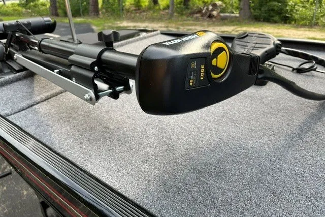 Slide: The Image of 2027 Tracker Bass Tracker Classic XL boat with Minn Kota trolling motor on deck. - 63