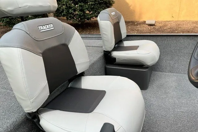 Slide: The Image of 2027 Tracker Bass Tracker Classic XL boat seats, gray and black upholstery, interior view. - 14