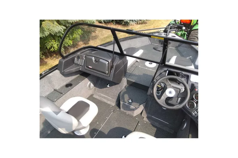 Slide: The Image of Interior view of 2027 Tracker Pro Guide V-175 Combo boat, featuring steering wheel and seating. - 45
