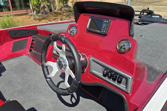 Slide: The Image of Red dashboard of 2027 Nitro Z18 XL boat with steering wheel and gauges. - 7