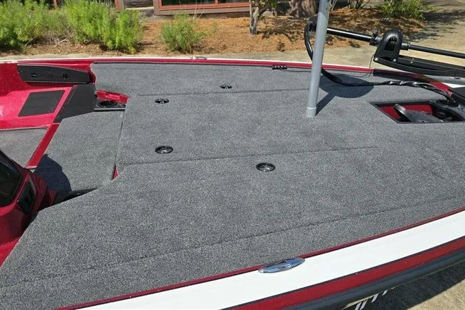 Slide: The Image of 2027 Nitro Z18 XL boat deck with gray carpet and red accents. - 11