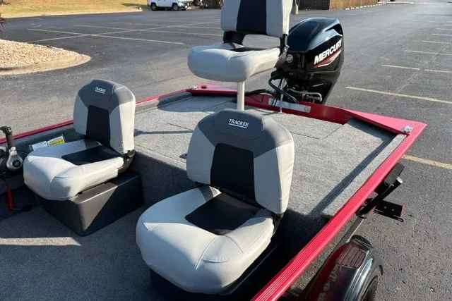 Slide: The Image of 2027 Tracker Bass Tracker Classic XL boat with seating and Mercury engine in a parking lot. - 18