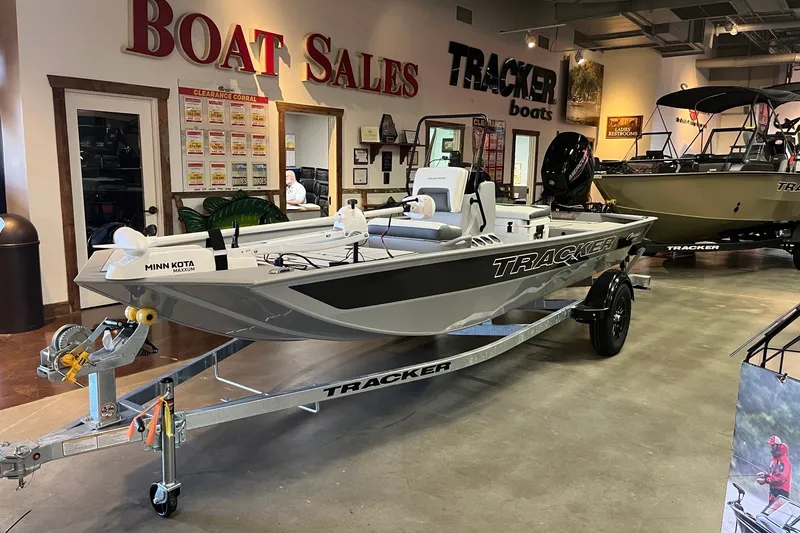 The Image of 2027 Tracker Bass Tracker Classic CC boat displayed in showroom with trailer. - 0