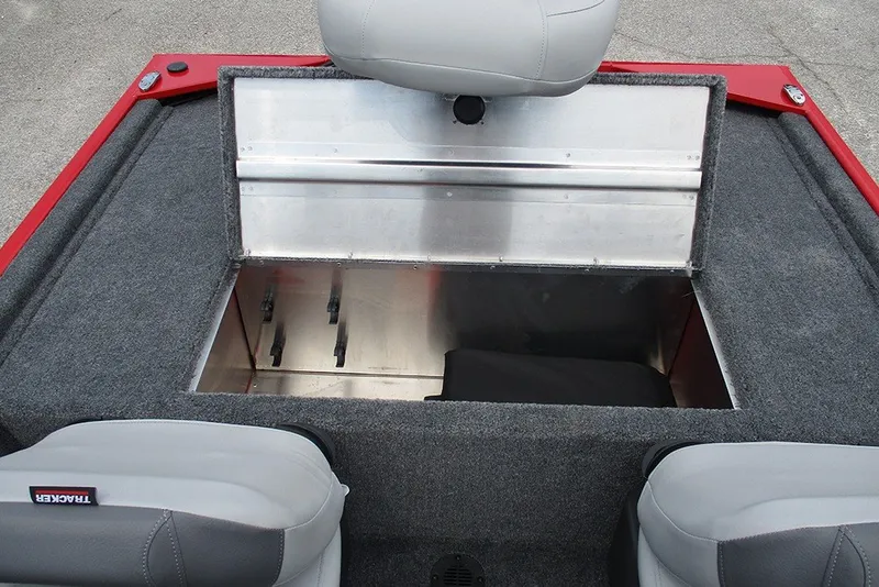 Slide: The Image of 2027 Tracker Bass Tracker Classic XL boat storage compartment with gray seating and red accents. - 19