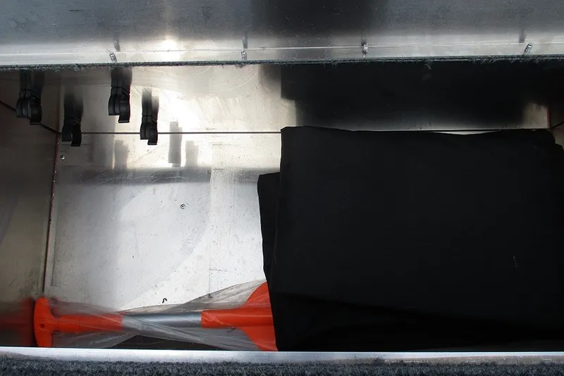 Slide: The Image of Storage compartment of 2027 Tracker Bass Tracker Classic XL boat with equipment. - 20