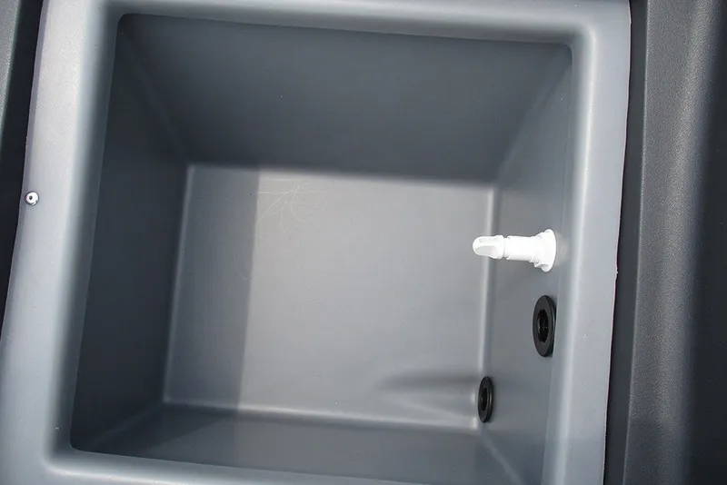 Slide: The Image of Bass Tracker Classic XL 2027 livewell interior with drain and fittings. - 14