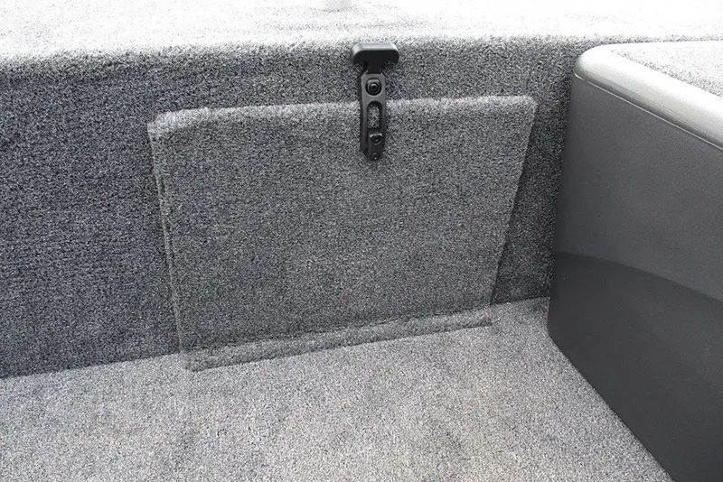Slide: The Image of 2027 Tracker Bass Tracker Classic XL interior storage compartment with carpeted finish. - 15